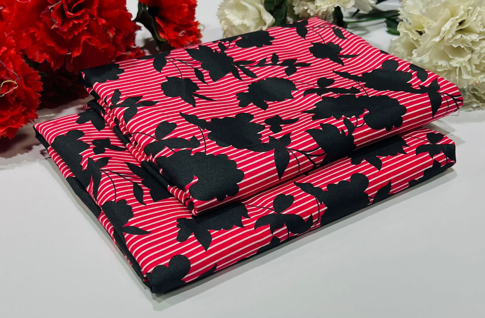 Unstitched Midnight Petals-bold red and white stripes overlaid with black floral silhouettes - Up Trends
